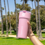 Hand holding a pink splitflask tumbler