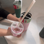 gif of a lady demonstrating how the splitflask tumbler lid works