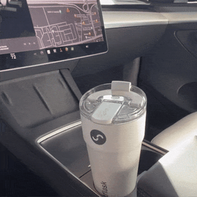 a gif image of Splitflask in a car cup holder and then tossed on a car seat.