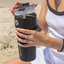 A girl opening a Splitflask stainless steel insulated tumbler water bottle