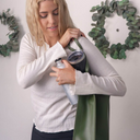 Lady struggling to juggle multiple drink containers